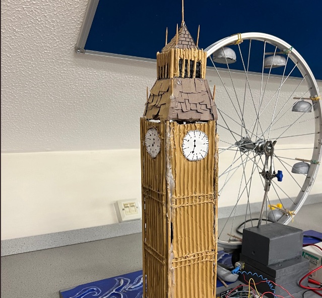 Student-built cardboard Big Ben beside a London Eye made from a bicycle wheel